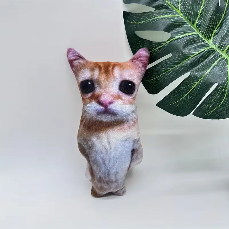 El Gato Cat Plush in the living room near a plant