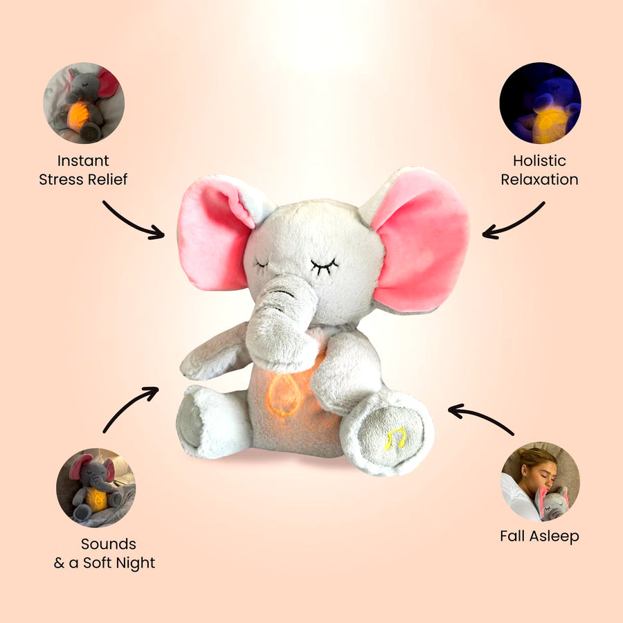 Breathing elephant plush toy displayed on a bed