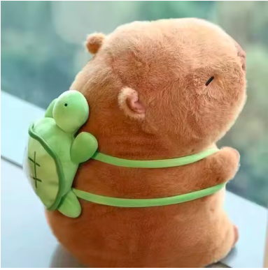Side view of a soft capybara stuffed animal