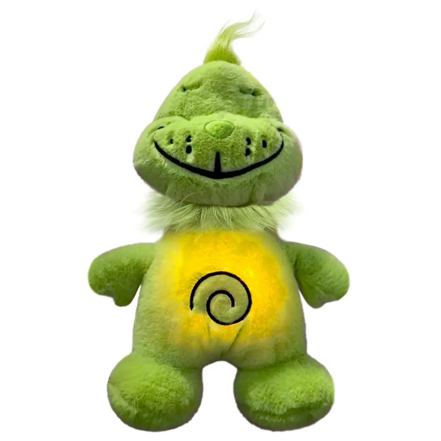 Holly Jolly Grumpkin plush glowing softly in a dark room