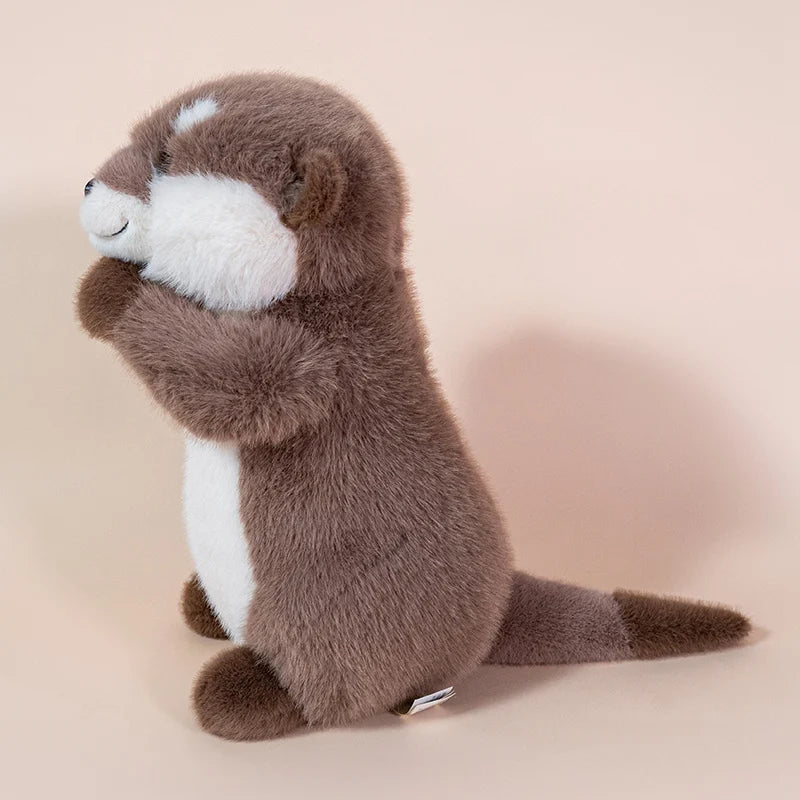 Side profile of Ollie the Otter™ plush toy showing full body and tail, soft cuddly sea animal stuffed toy in 10 and 14 inch sizes for kids, gifts, and comfort