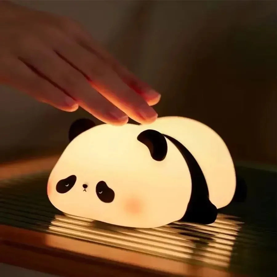 Hand patting the panda night light to change brightness