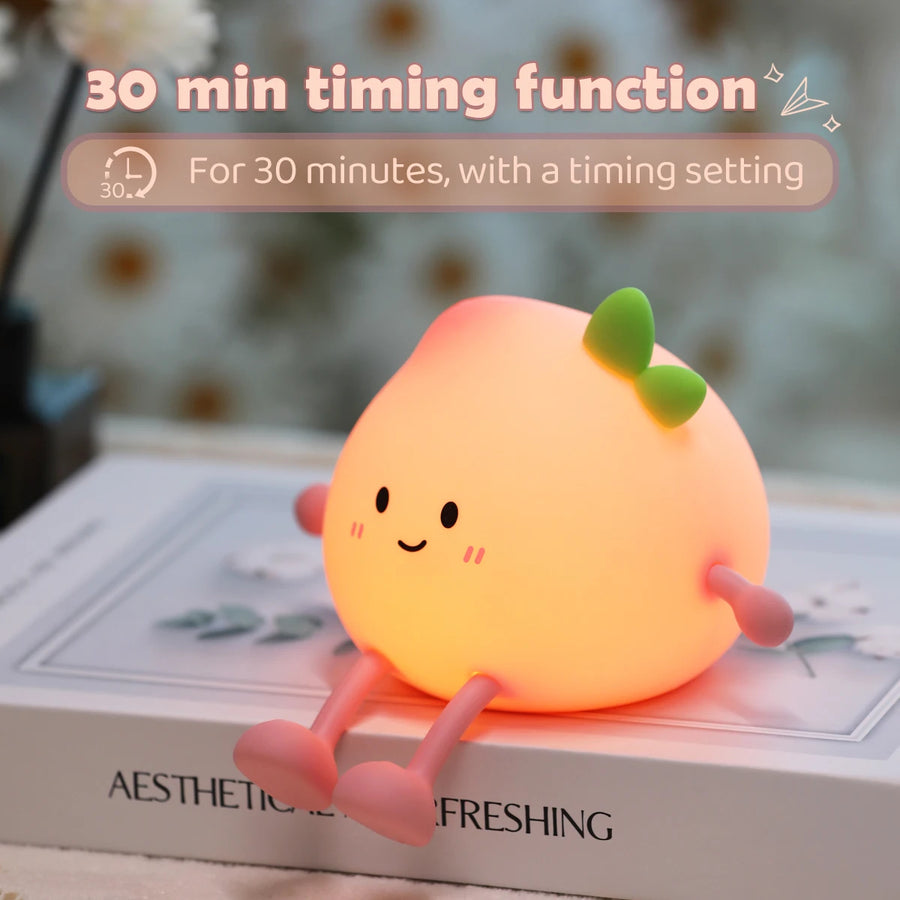 Rechargeable peach night light connected to a charging cable