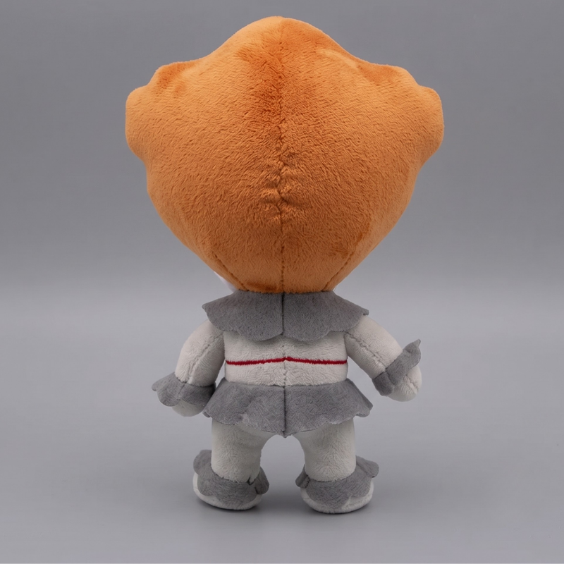 Back view of 16cm Pennywise IT clown plush with orange hair and grey costume