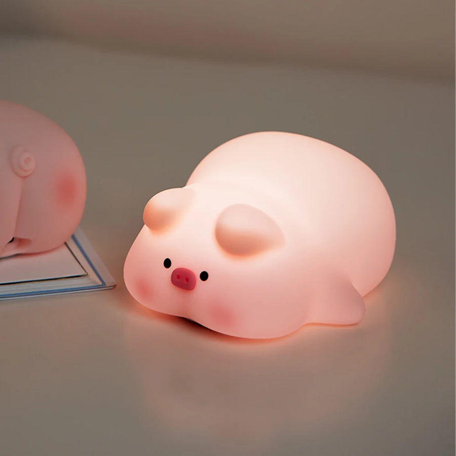 Pink pig night light used in a bedroom for gentle nighttime lighting