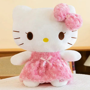 Plush toy resembling a character with a pink bow and dress on a neutral background