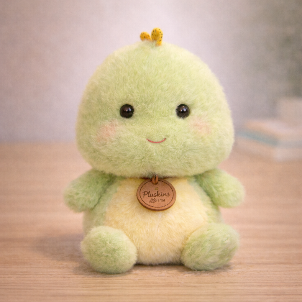 Plush toy with a smiling face and a tag on a wooden surface