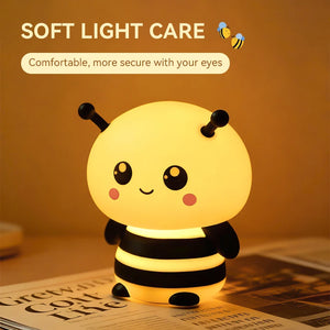 Cute bee night light on a bedside table as kids' room decor