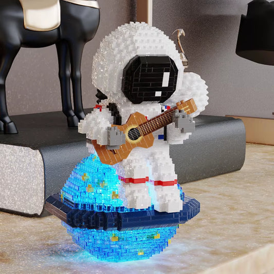 Astronaut guitar building block model with LED light base displayed as decorative desk piece