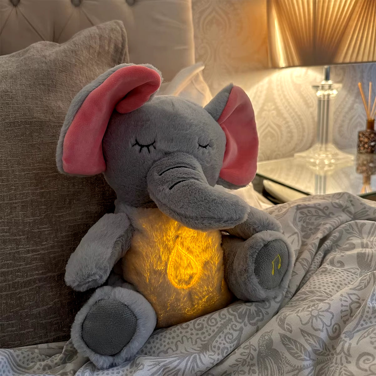 Breathing elephant plush glowing softly with calming light