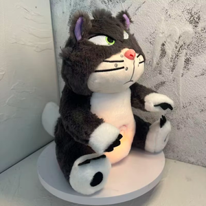 Side view of breathing Lucifer cat plush toy with soft glowing light, showing calming anxiety relief feature and comforting sleep aid design