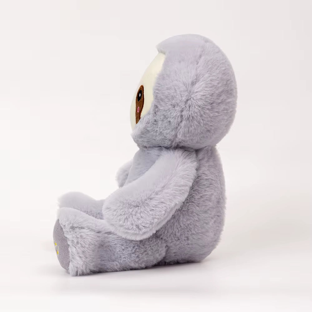 Side view of breathing sloth plush toy showing soft fabric and shape, calming stuffed animal designed for kids comfort and sleep support