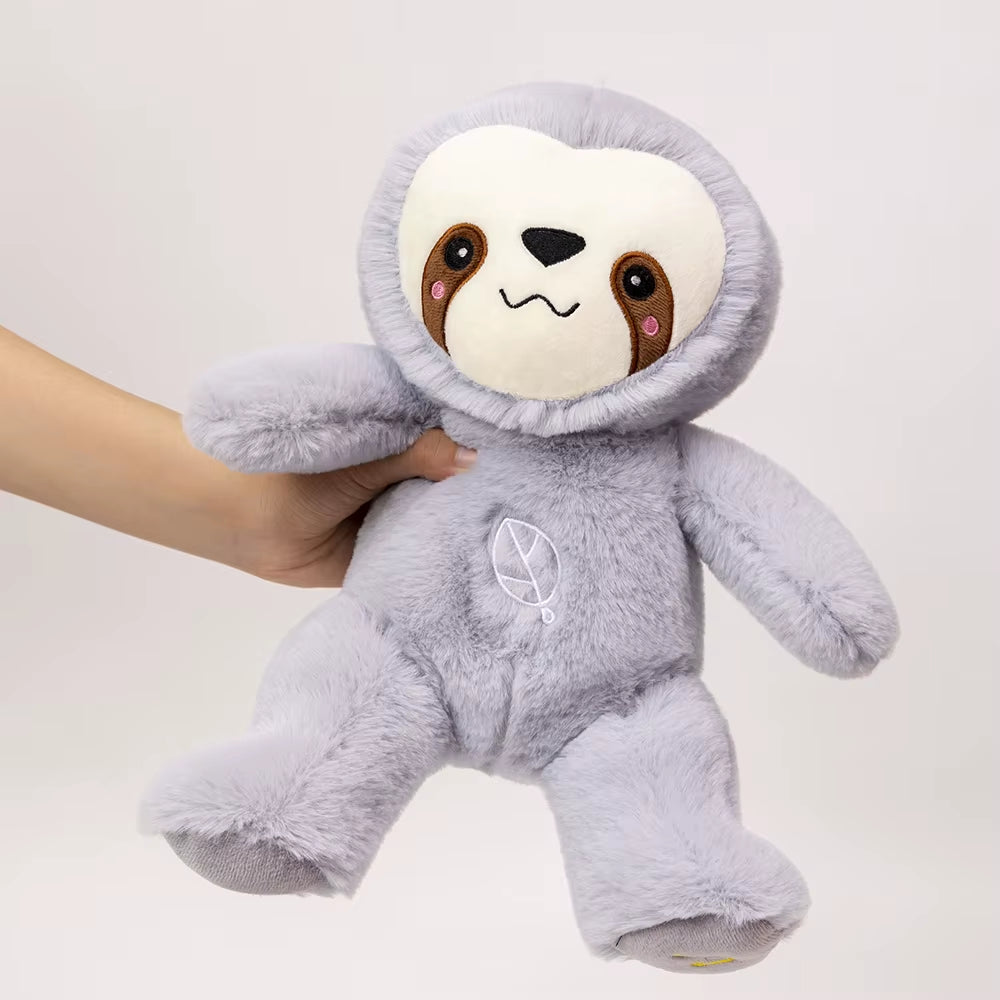 Breathing sloth plush toy held in hand showing size and softness, calming sleep companion for kids and anxiety relief