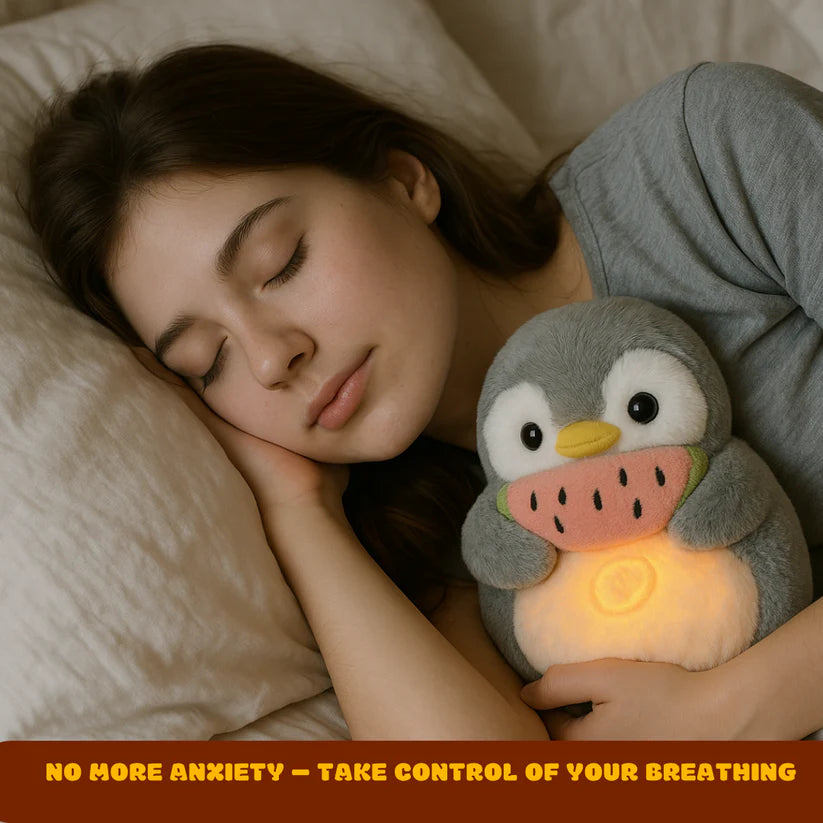 Young girl peacefully sleeping with the Breathing Penguin Plush for anxiety relief and bedtime comfort.