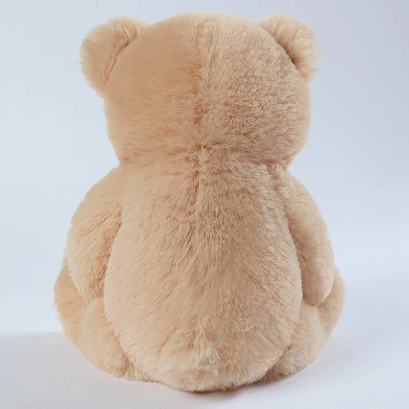 Classic teddy bear plush being hugged, showing its comforting softness