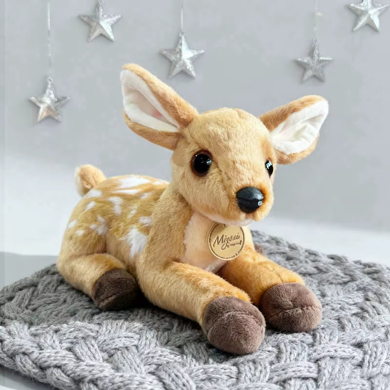 Cute baby deer plush toy on a soft blanket with star decor, cozy fawn stuffed animal perfect for nursery decor, kids gifts, and bedtime comfort