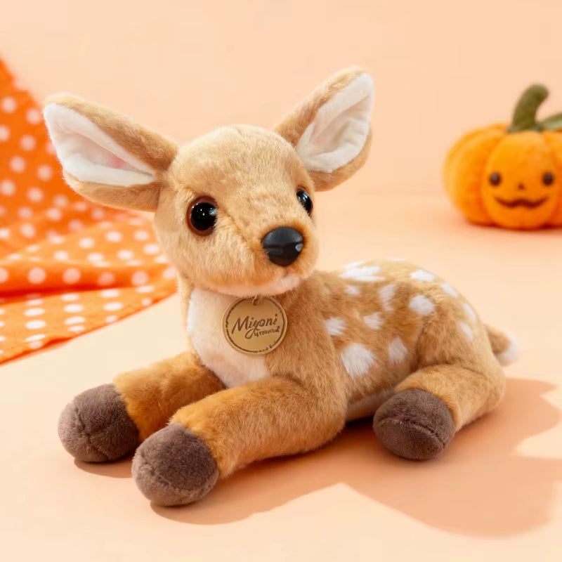 Cute baby deer plush toy in a cozy fall setting with warm tones, soft fawn stuffed animal perfect for gifts, kids, and seasonal home decor