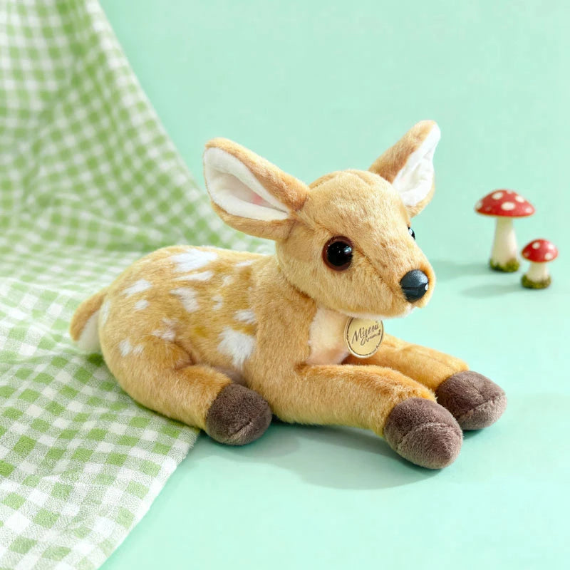 Cute deer plush toy on green checkered fabric with a soft pastel background, aesthetic fawn stuffed animal perfect for kids room decor and gifts