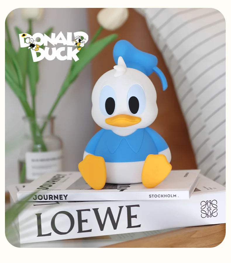 Donald the Duck–inspired night light glowing softly on a bedside table