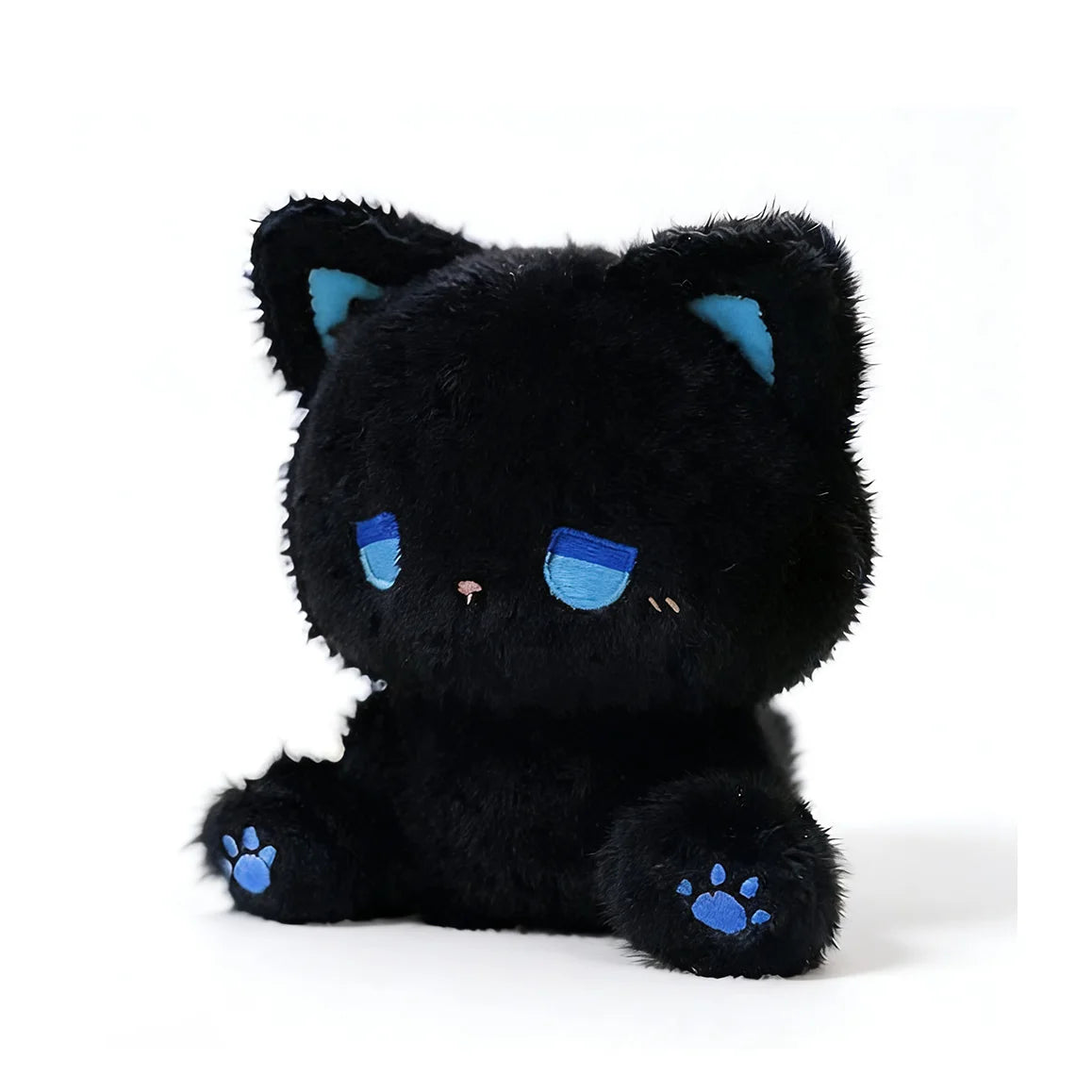 Emo cat plush in a cozy setting creating a comforting atmosphere