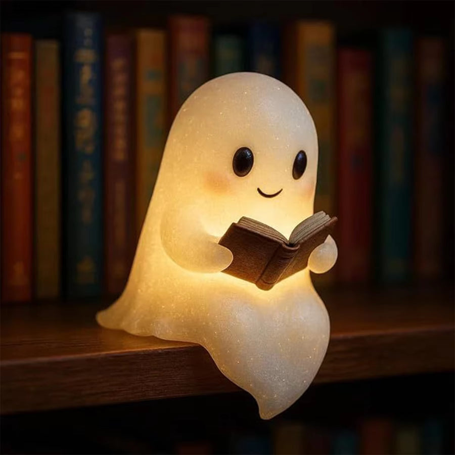 Halloween ghost night light glowing in a dark spooky room