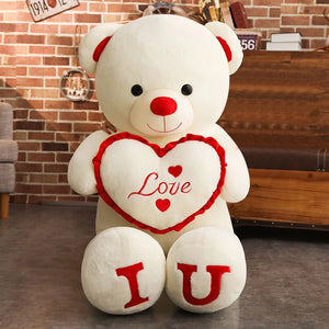 Person hugging a giant 100cm teddy bear plush to show scale and softness