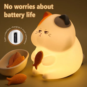 Gluttonous cat night light connected to a USB charging cable