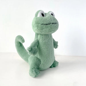 green lizard plush toy side view soft stuffed animal on white background