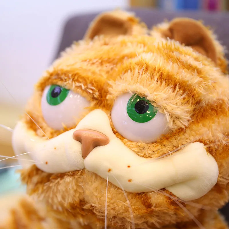 Close-up of the grumpy Garfield plush cat face