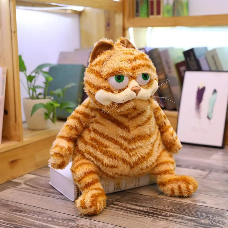 Front view of grumpy Garfield plush lazy cat toy