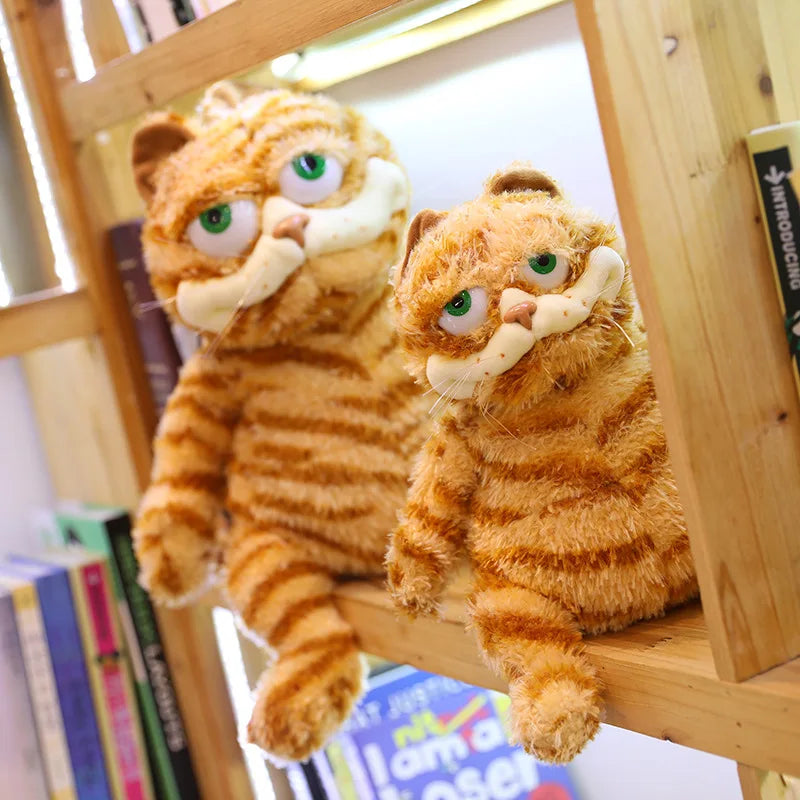 Grumpy Garfield plush toy laying in a relaxed lazy pose