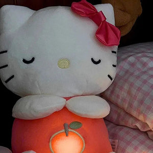Hello Kitty breathing plush glowing at night on bed, calming sleep companion for kids with soft light