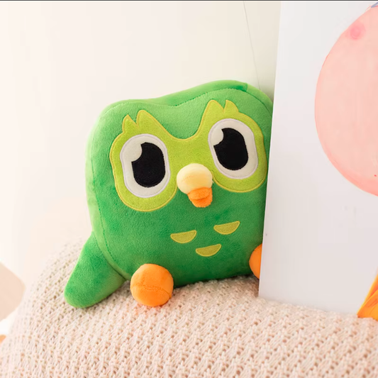 Cute kawaii owl plush toy sitting with soft green design