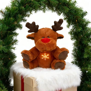 Soft musical moose plush toy presented as a Christmas gift for kids