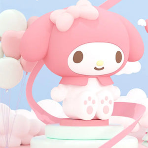 Tap-activated My Melody night light glowing softly beside a bed at night