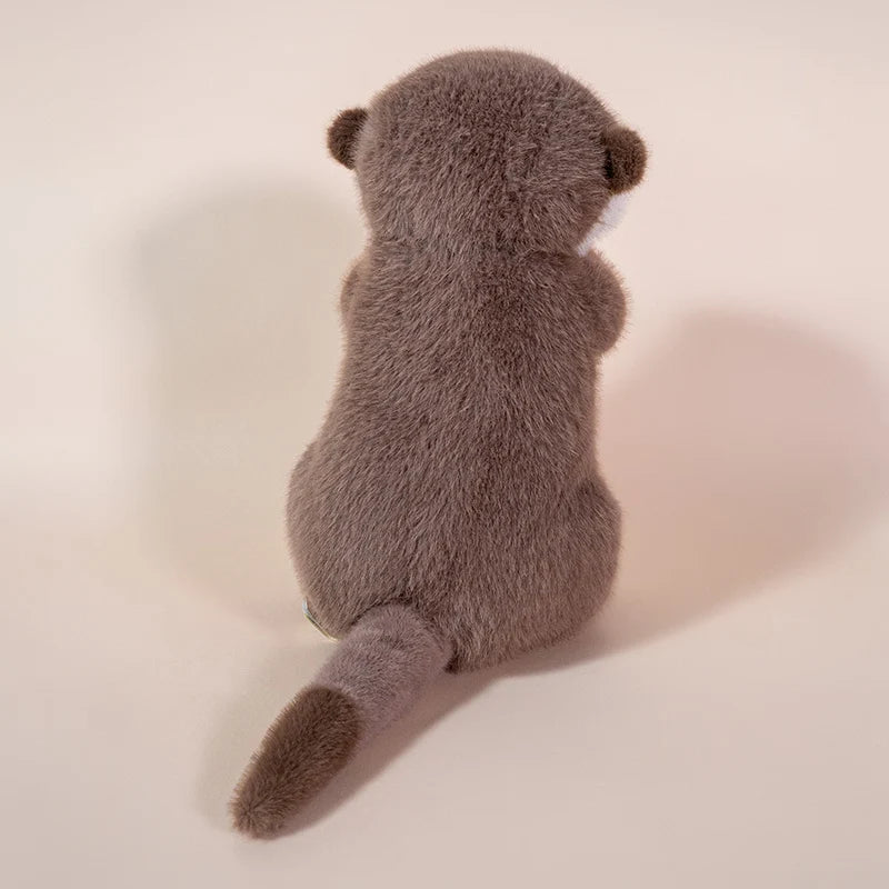 Back view of Ollie the Otter™ plush toy showing soft fur texture and tail, cuddly sea animal stuffed toy in 10 and 14 inch sizes for kids, gifts, and comfort