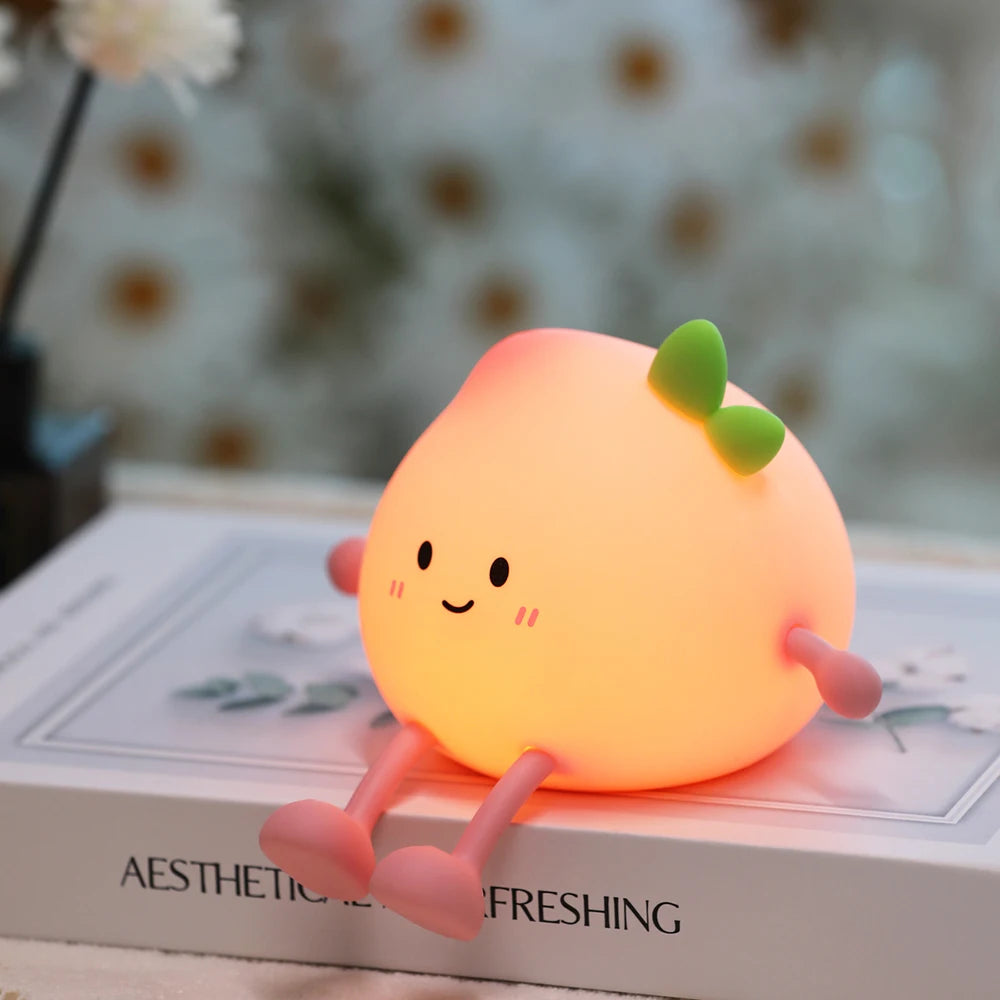Peach-shaped silicone LED night light with a soft glowing design