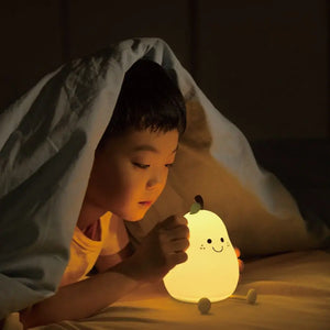 Hand tapping the pear night light to change brightness