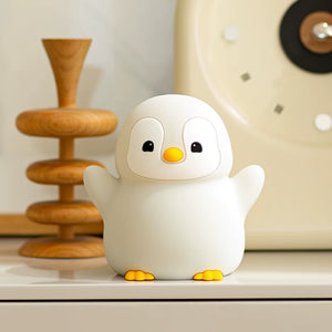 Cute penguin night lamp used as decor in a child’s bedroom