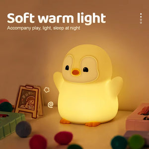 Penguin night light placed in a cozy nursery room