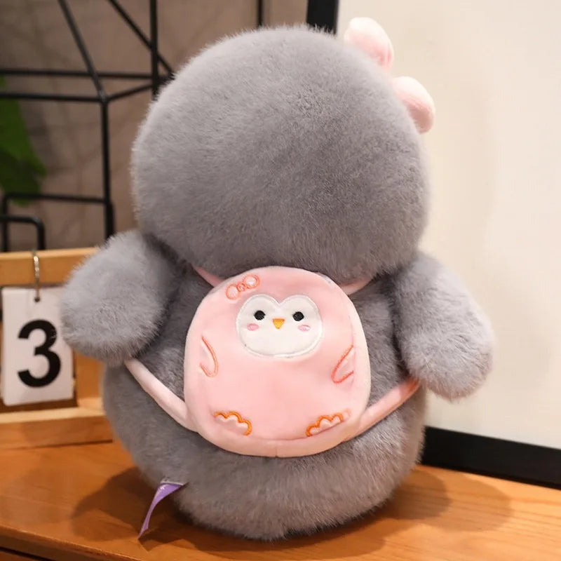 Soft penguin plush couple placed on a bed for a cozy and romantic setting