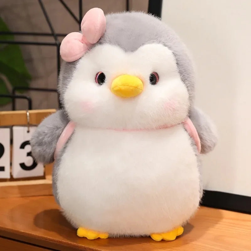 Front view of a soft penguin plush couple with a cute matching design
