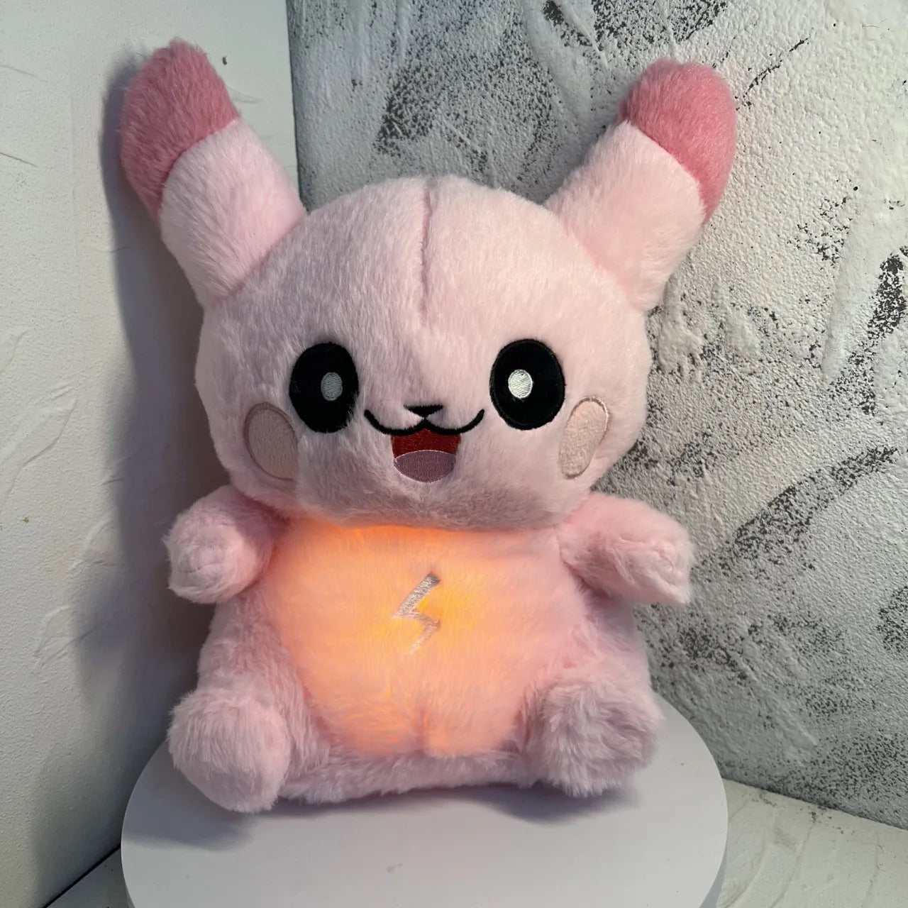 PikaBoo™ pink breathing plush glowing softly with calming light, soothing stuffed toy for kids sleep, anxiety relief, and bedtime comfort