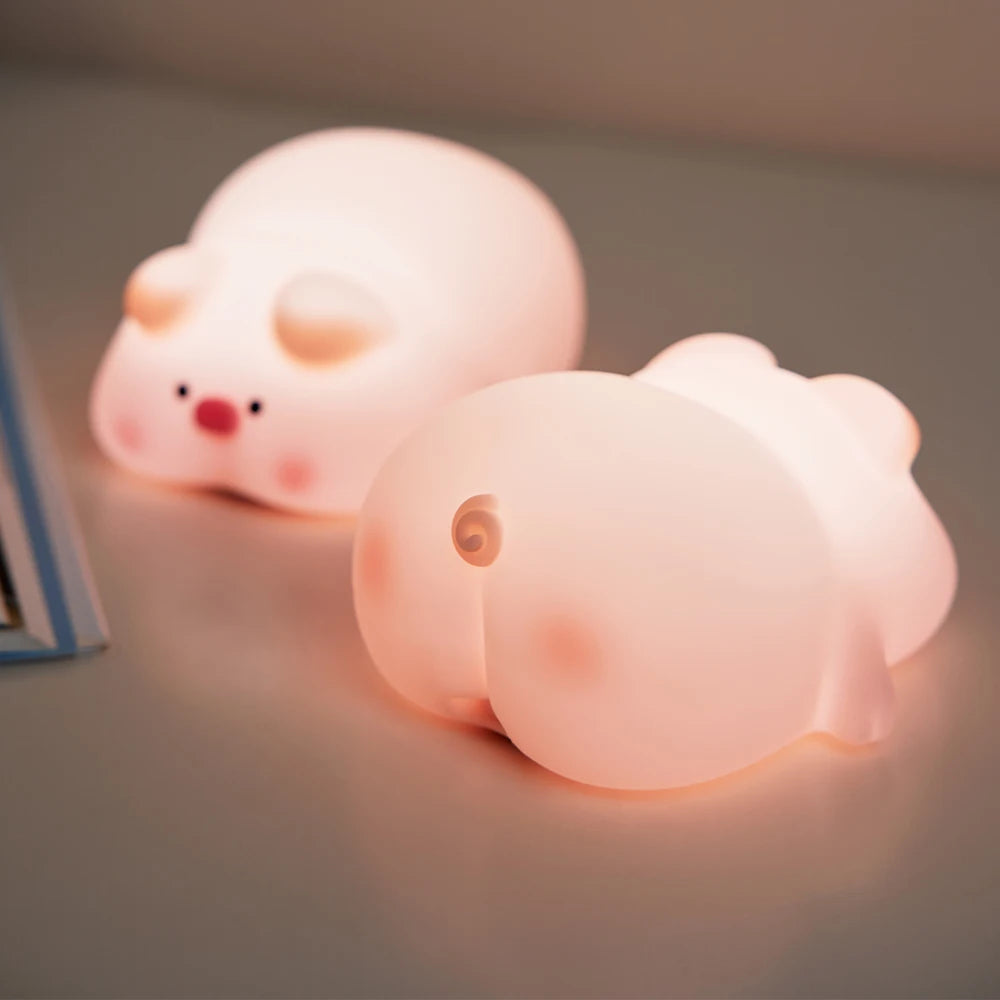 Close-up view of the pink pig night light showing its cute design details