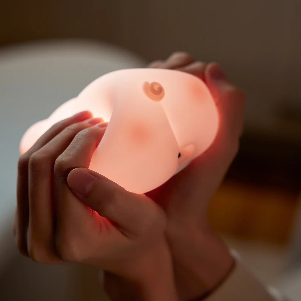 Pink pig night light presented as a cute and comforting gift idea