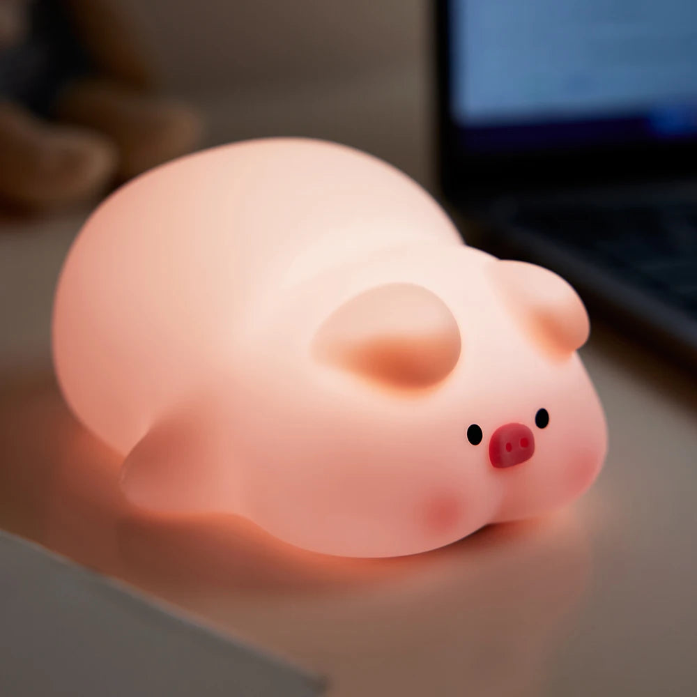 Soft glowing pink pig night light creating a cozy nighttime atmosphere