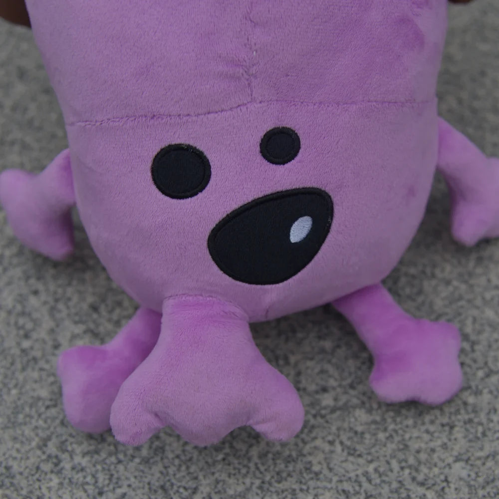 Close-up of the soft fabric texture of the purple dog plush