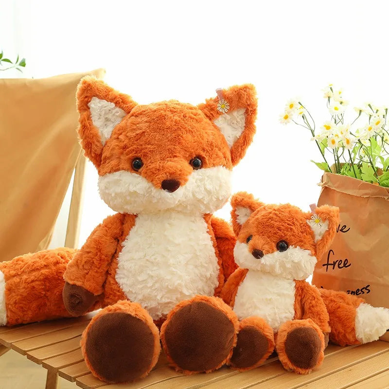Side view of the red fox plush toy showing its shape and tail