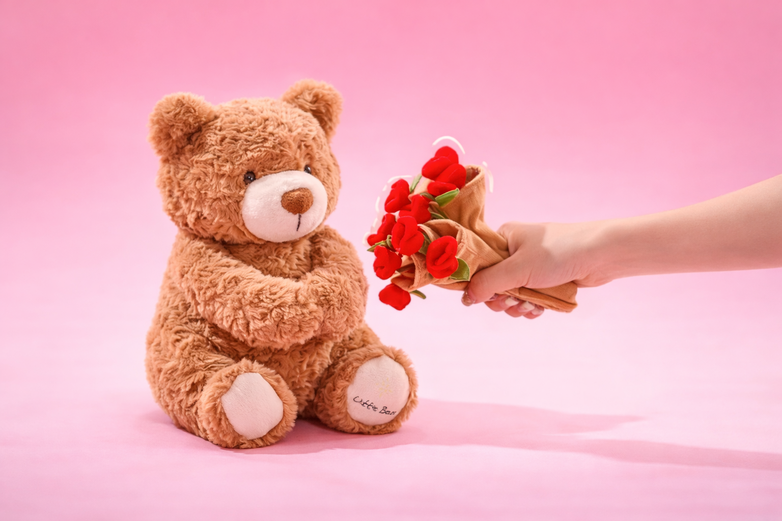 Rose bear plush displayed in a romantic setting with soft lighting