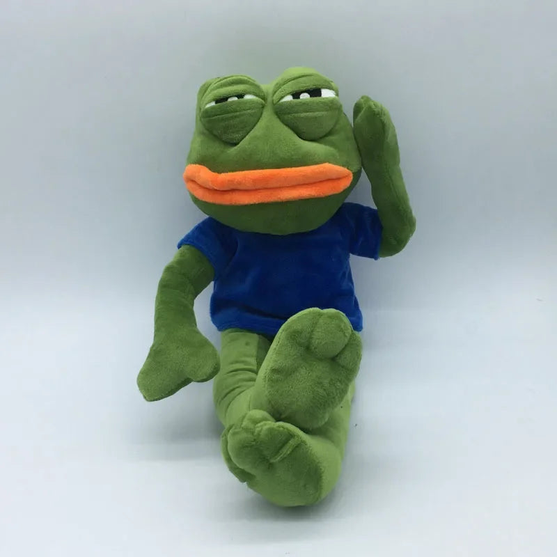 sad pepe frog plush toy sitting pose wearing blue shirt on white background